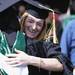 Eastern Michigan graduate Colleen Brophy, hugs a fellow graduate following commencement, outside the Convocation Center in Ypsilanti, on Sunday, April 29, 2012. For annarbor.com By: Joe Sharp